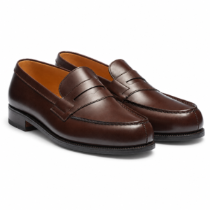 The Low Heel Penny dark brown leather penny loafers with moc-toe apron, saddle strap, traditional penny slot and low stacked heel